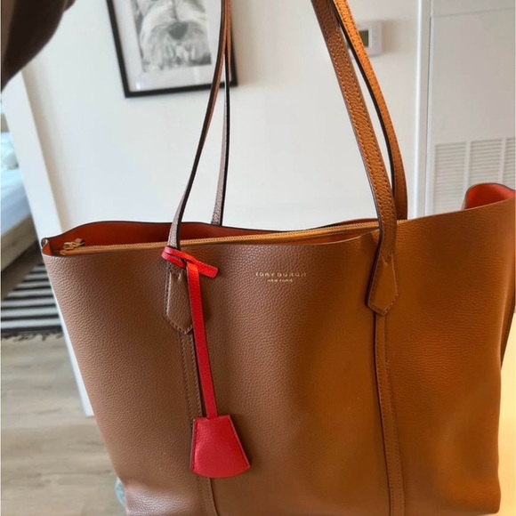 Tory Burch Handbags - Tory Burch Cognac Leather Tote with Red Charm